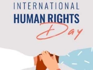 Four human hands support each other on the International Human rights day.