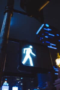 Image of walkm sign stick figure on crosswalk- Negligence compensation