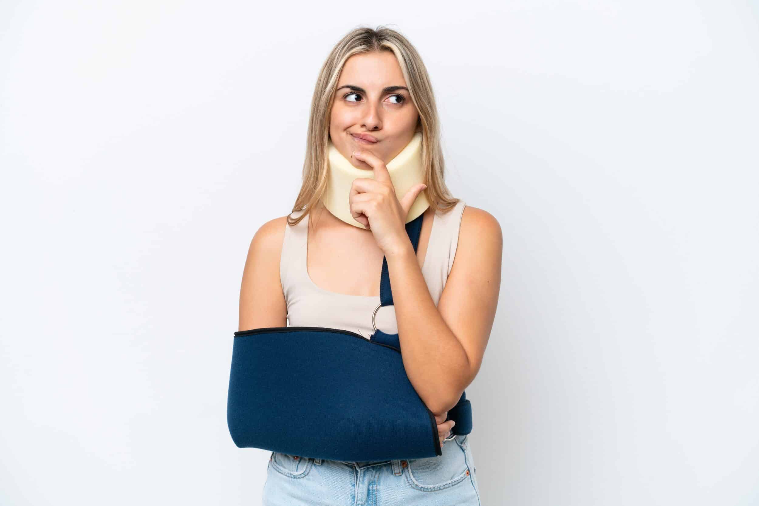 Hurt woman with a broken arm and neck brace in need of legal help for her personal injury
