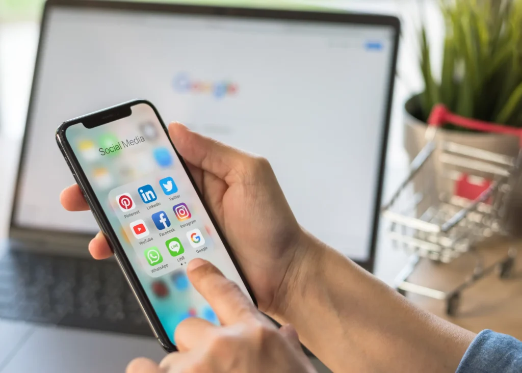 Person looking through social media apps on their phone